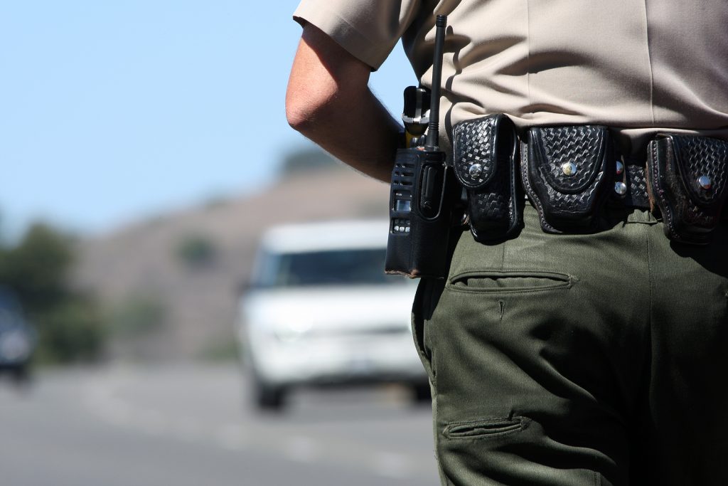 A police officer watching traffic A police officer watching traffic