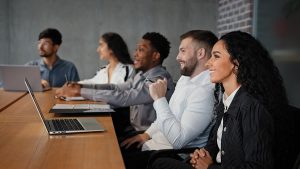 Multiracial Office Workers Watching Presentation Webinar Online