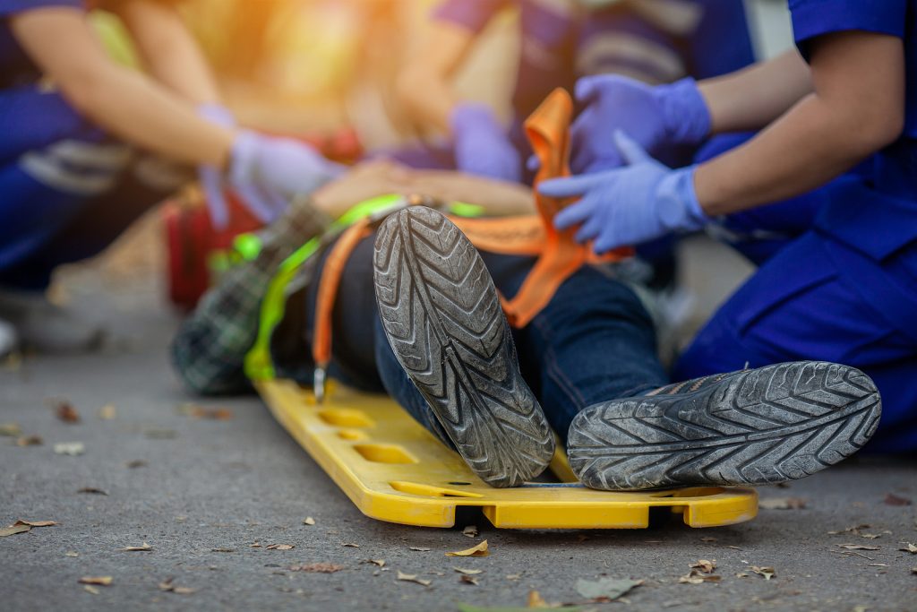 Selective Focus Shoe . Team Paramedic Firs Aid Accident On Road.