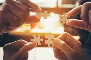 Team Hand Power Full Hand Placing The Jigsaw Puzzle Piece For Team Hand Power Full Hand Placing The Jigsaw Puzzle Piece For